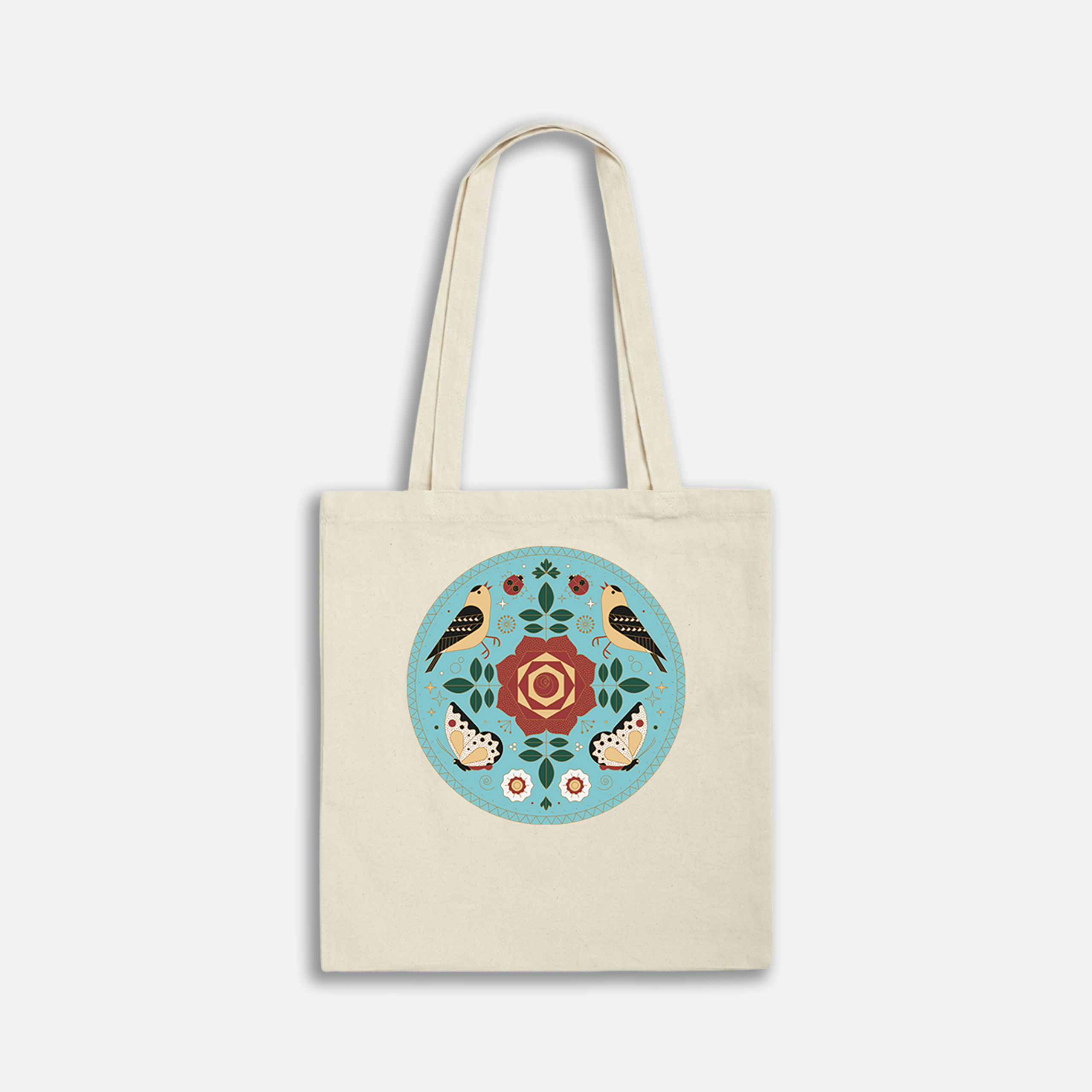 Eco-friendly tote bag featuring a colorful floral and bird design on a white background.