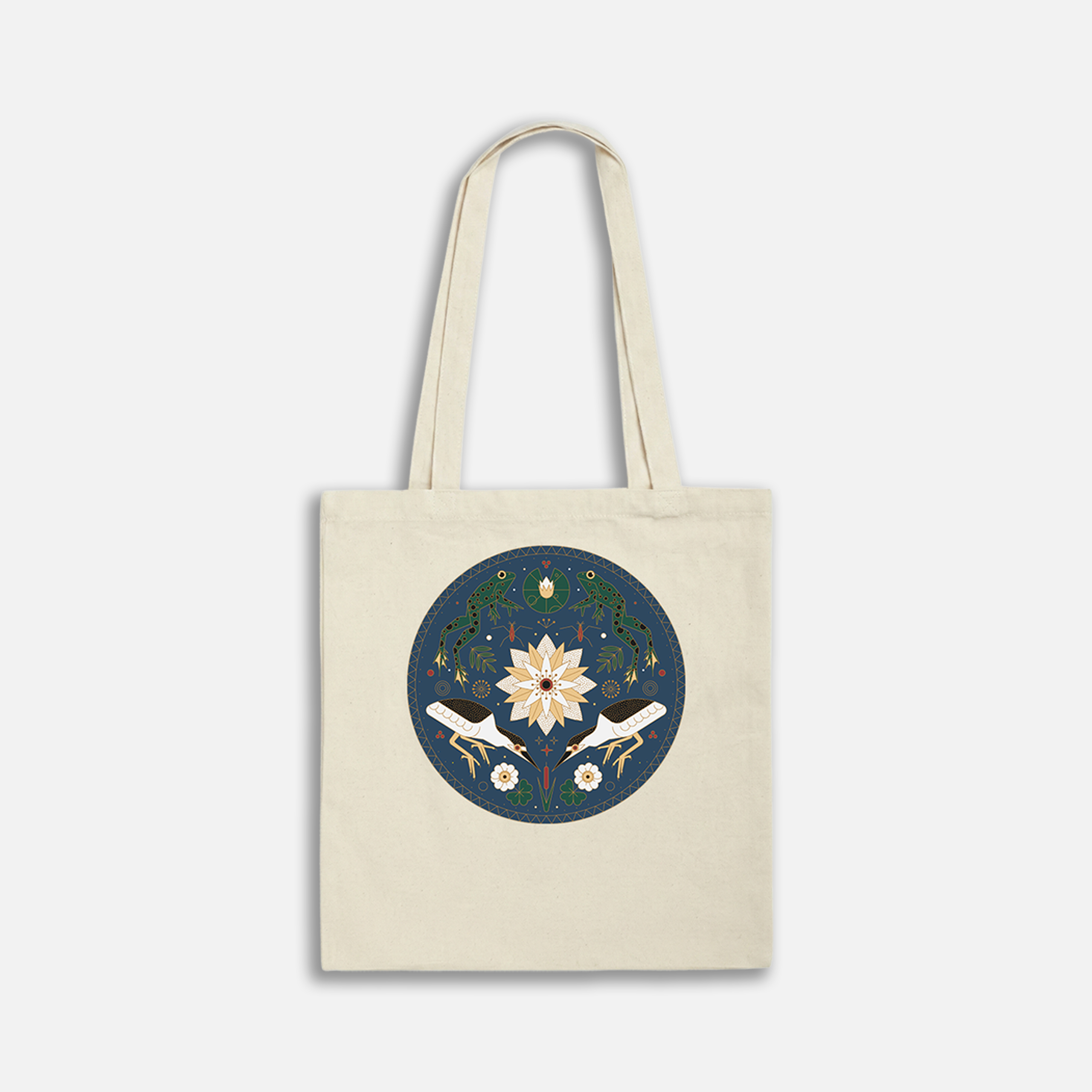Canvas tote bag with intricate floral mandala design on a navy background, showcasing a symmetrical pattern.